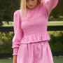 The Eubanks Top in Watermelon Stripe has a fitted bodice, puff sleeves, and smocked cuffs