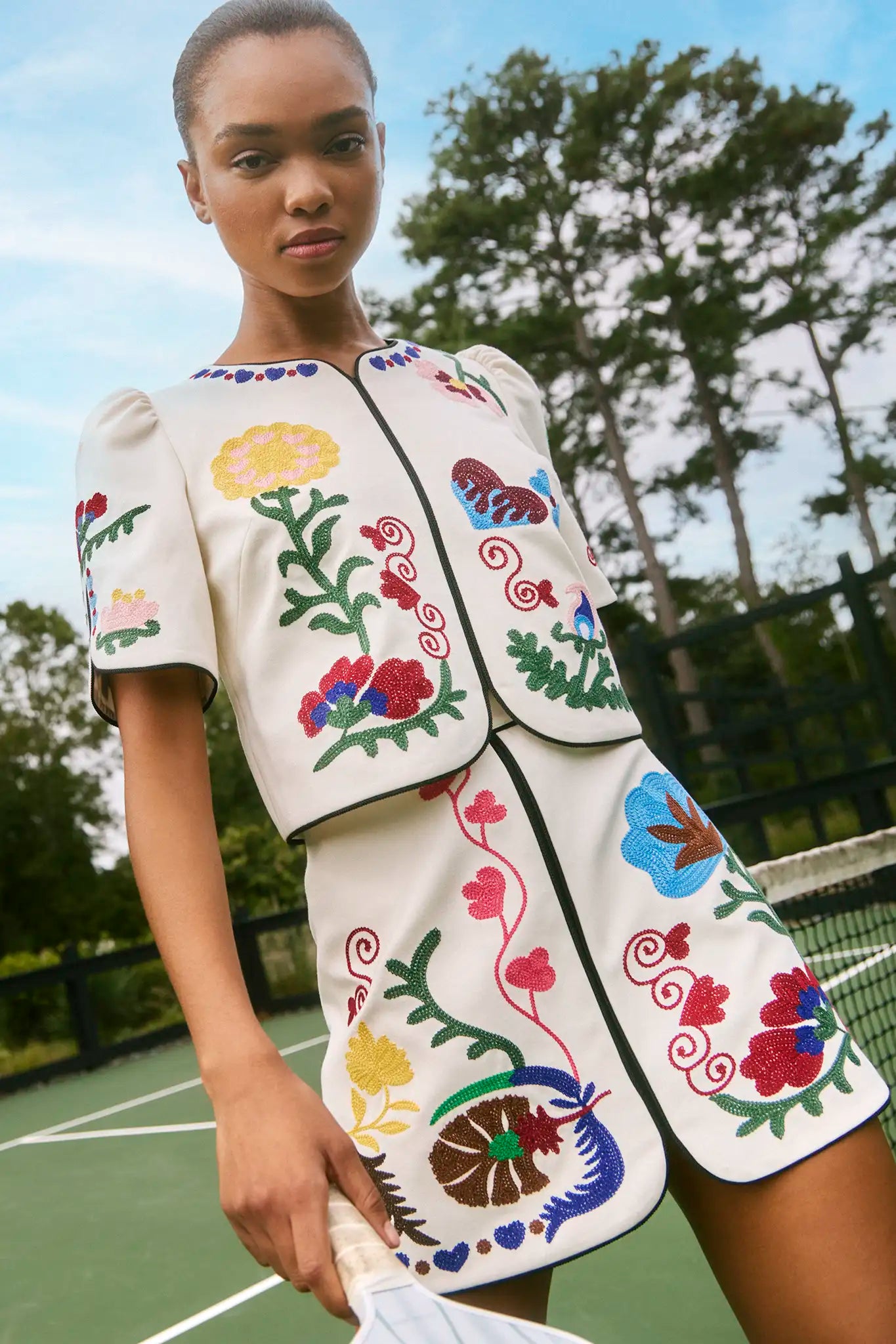 The Beeson Top is a crew neckline and elbow-length sleeves, non-fitted bodice with colorful detail