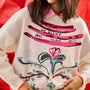 The Elizabeth Sweater is a crewneck with a pull-over design in the anniversary print.