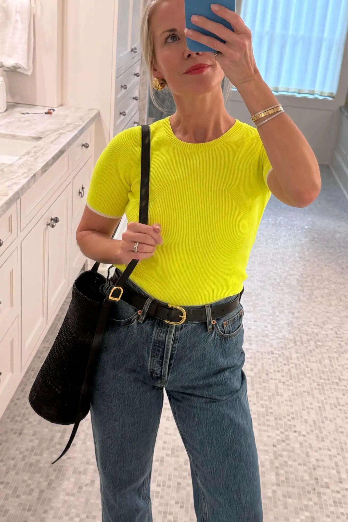 A fitted sweater-knit tee in vibrant neon yellow with a classic crew neckline and short sleeves.