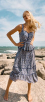 Vine Stripe peplum midi dress with a sleeveless bodice, sweetheart neckline, full circle skirt.