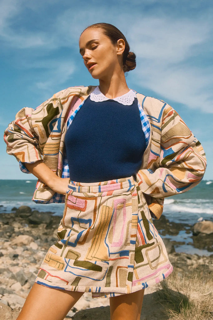 Throw-on jacket with curved, open front, and dolman sleeves.